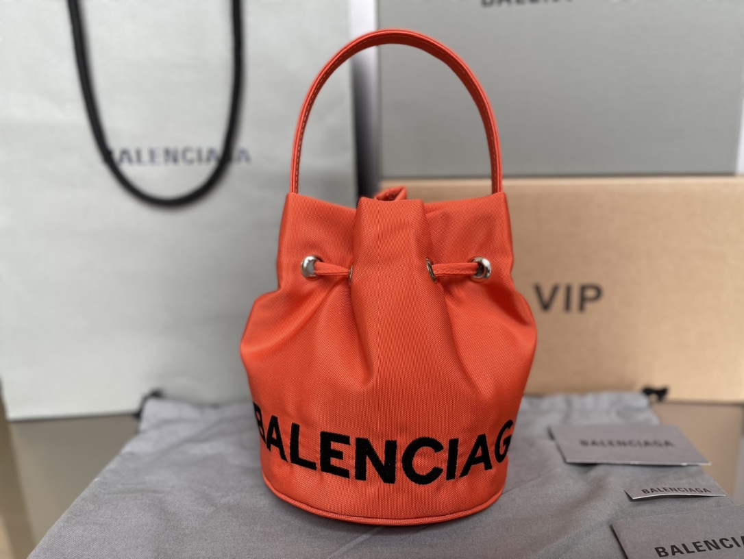 Copy-Balenciaga-Wheel-XS-Drawstring-Bucket-Bag-in-Orange.jpg
