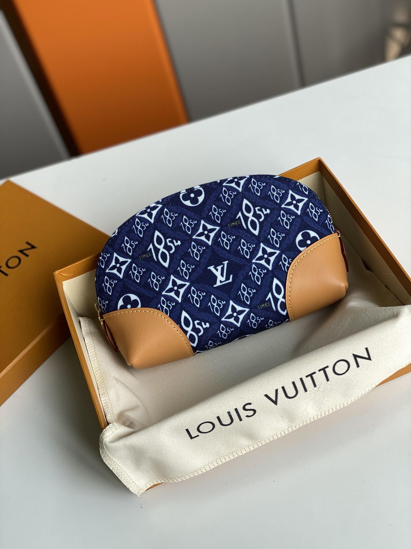 Top-Replica-Louis-Vitton-M80307-Since-1854-Cosmetic-Pouch-PM-Jacquard-Blue.jpg