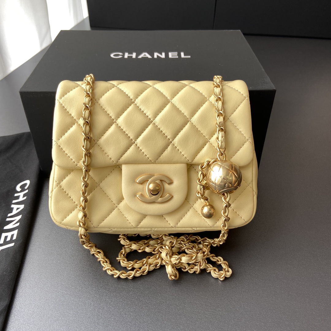 Chanel-Mini-Flap-Bag-with-Aged-Gold-Hardware-with-Quilted-CC-Toggle-Ball-Yellow.jpg