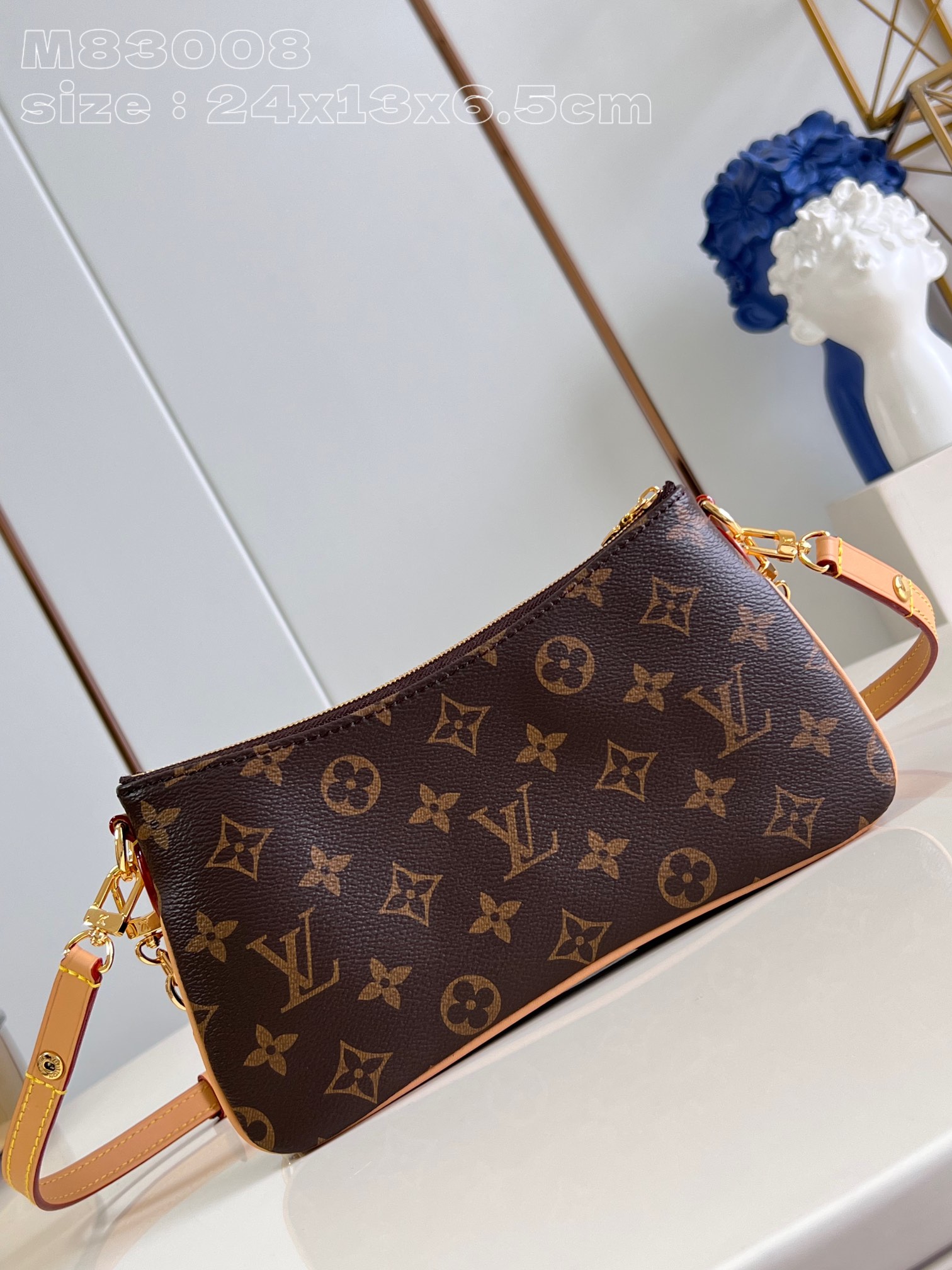 Louis-Vuitton-M83008-Liv-Pochette-Monogram-coated-canvas.jpg
