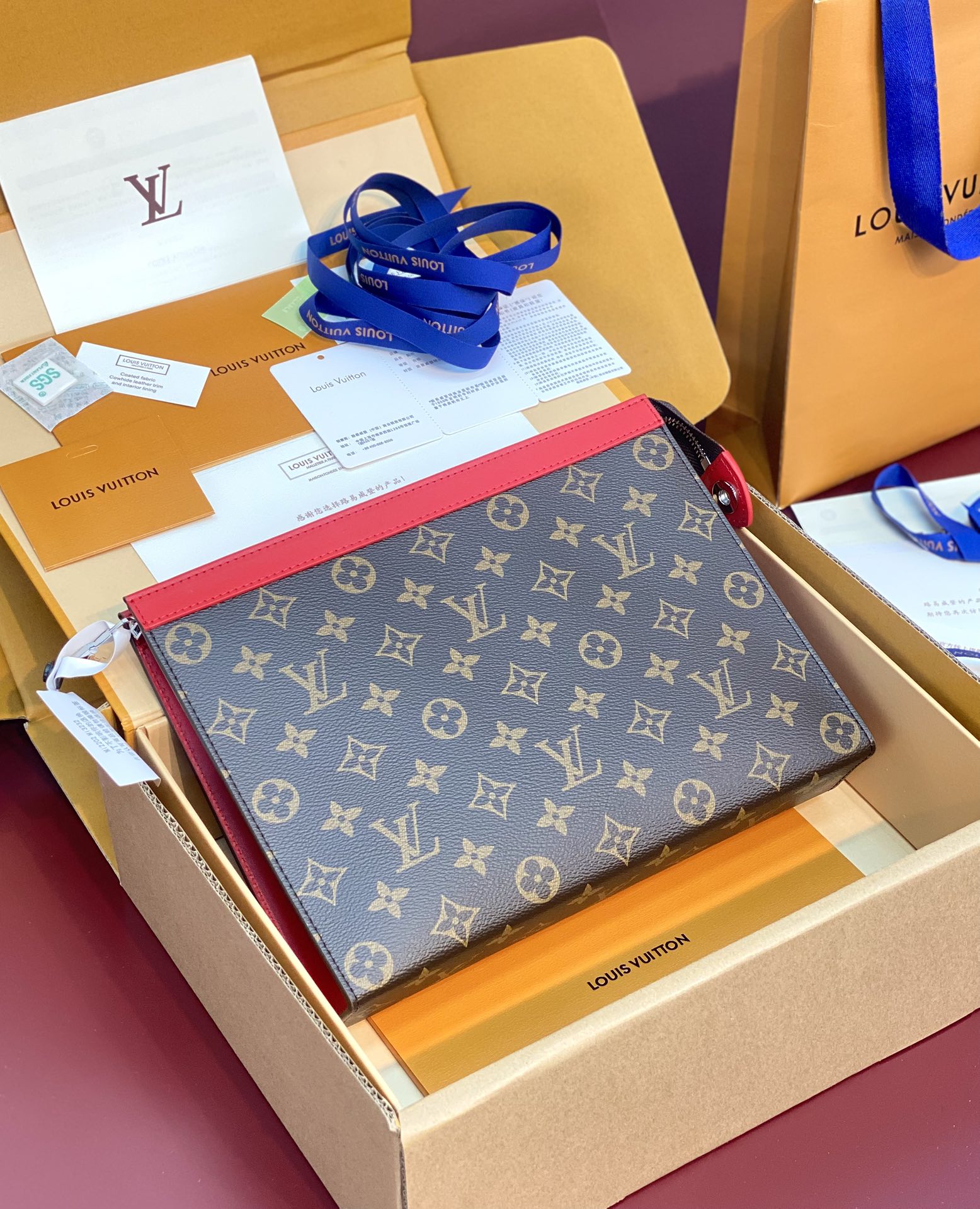 Louis-Vuitton-M12820-Pochette-Voyage-MM-Monogram-Macassar-coated-canva-Red.jpg