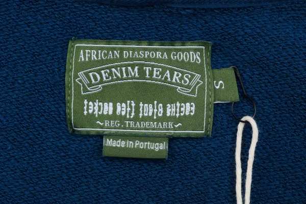 Denim Tears logo tag