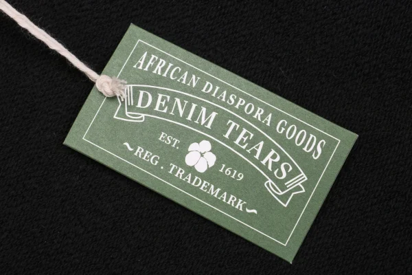 Denim Tears logo tag