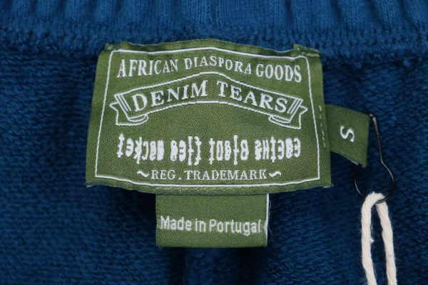 Denim Tears logo tag