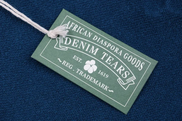 Denim Tears logo tag