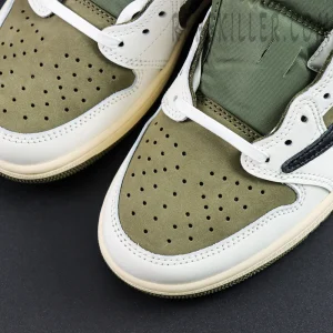 Close-up of the toe box on the Travis Scott Air Jordan 1 Low Reverse Olive with green nubuck and white leather overlays.