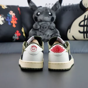 Rear heel shot of Travis Scott AJ1 Low Reverse Olive with Cactus Jack face logo and Air Jordan Wings logo.