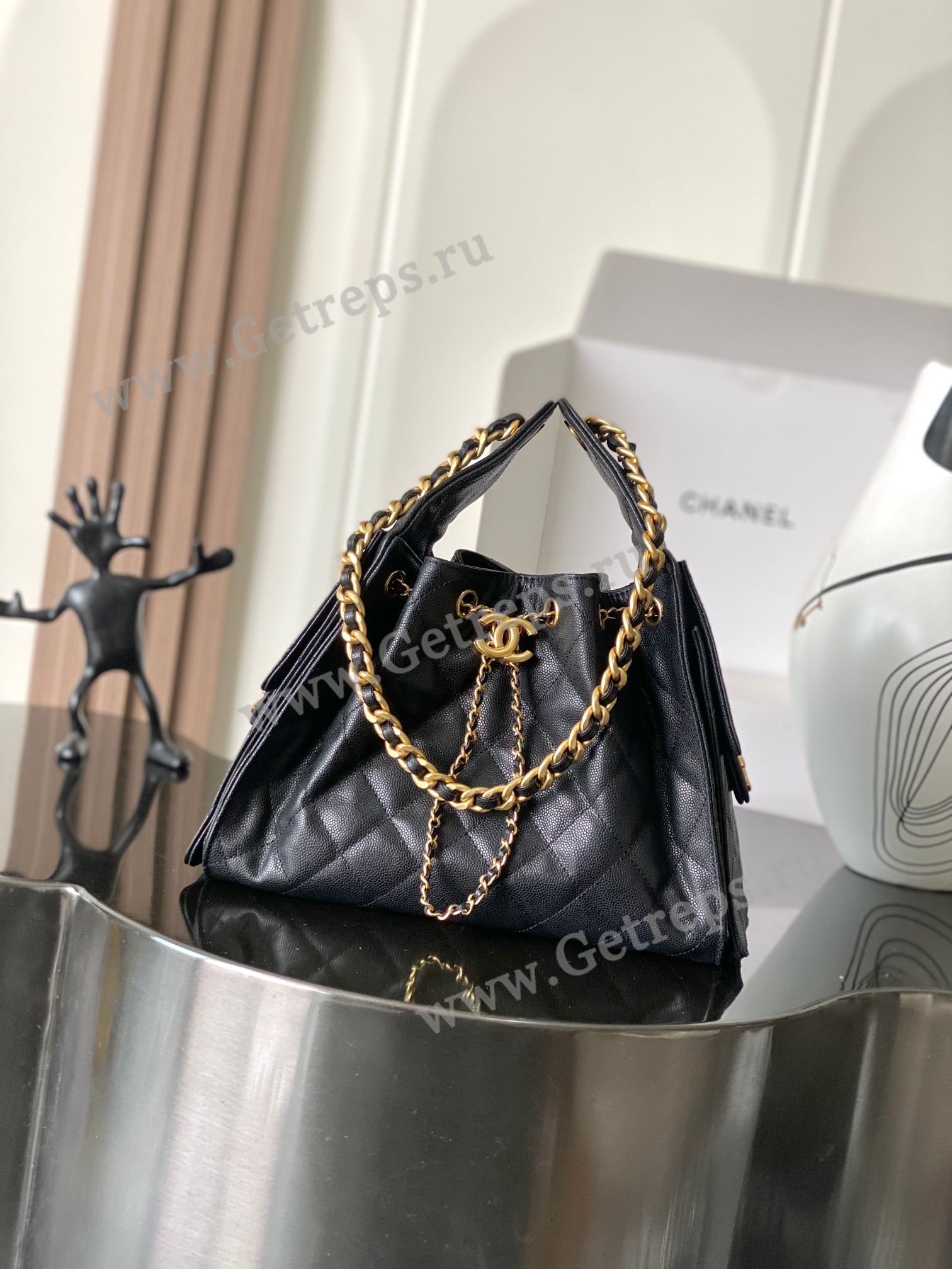 Chanel-25-Hobo-Handbag-Black-Caviar-with-Gold-Hardware.jpg