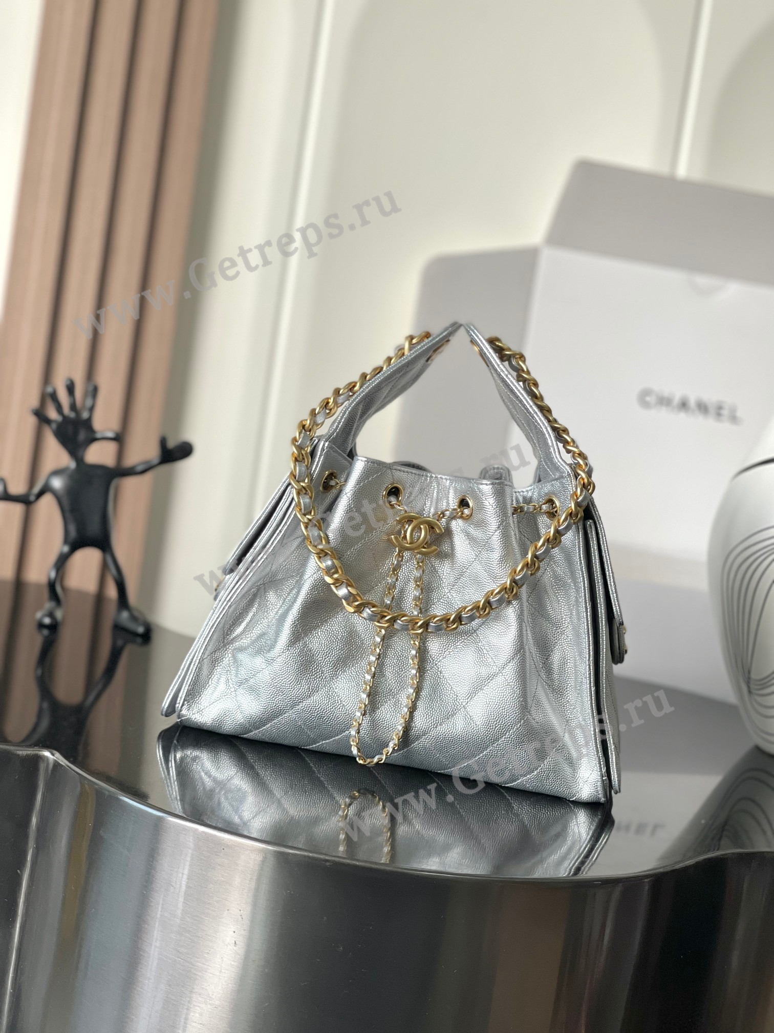 Chanel-25-Hobo-Handbag-Silver-Caviar-with-Gold-Hardware.jpg