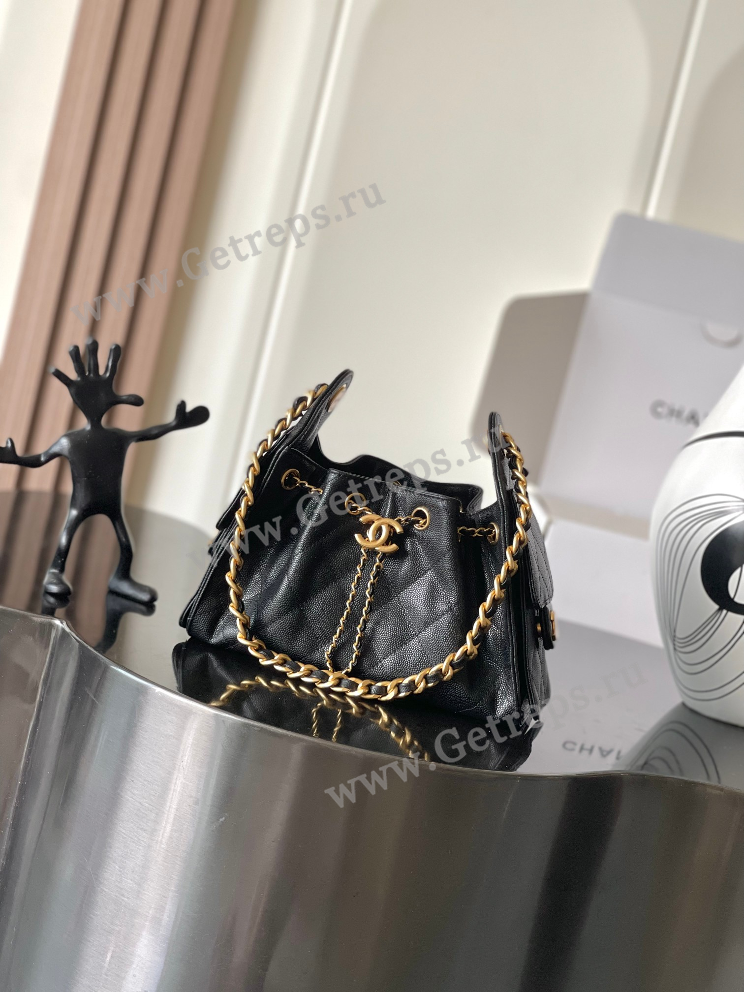 Chanel-25-Mini-Hobo-Handbag-Black-Caviar-with-Gold-Hardware.jpg