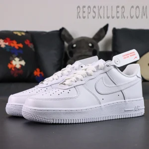 Angled front view of Nike Air Force 1 ’07 “Triple White” showing smooth all-white leather upper.
