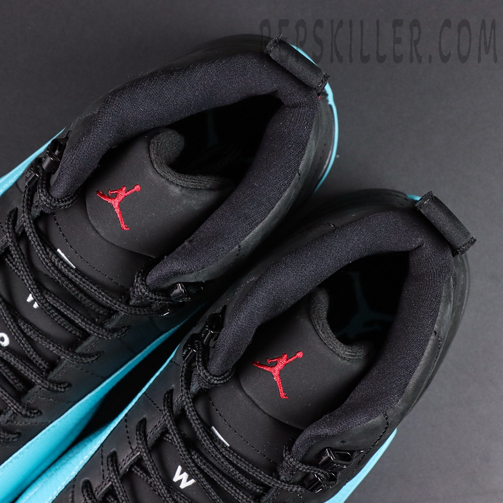 Top view of Air Jordan 12 Retro ‘Gamma Blue’ highlighting black padded collars and red Jumpman logo on tongue.