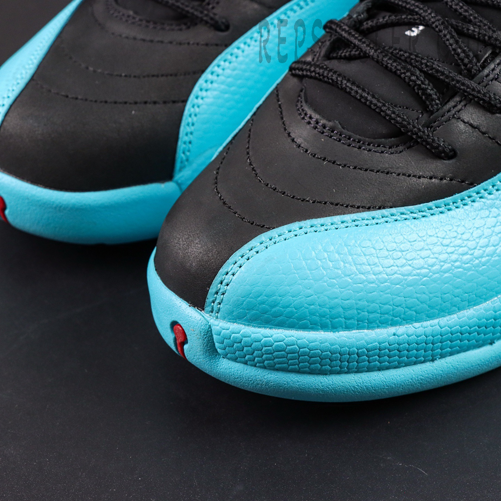 Macro shot of Air Jordan 12 Retro ‘Gamma Blue’ textured blue leather mudguard and black forefoot upper.