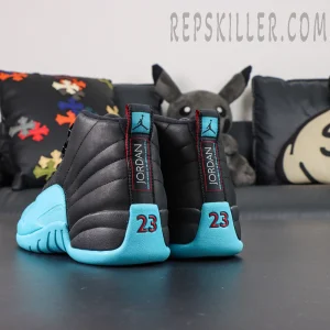 Angled back view of Air Jordan 12 Retro ‘Gamma Blue’ showing both heels with red “23” embroidery and pull tab details.