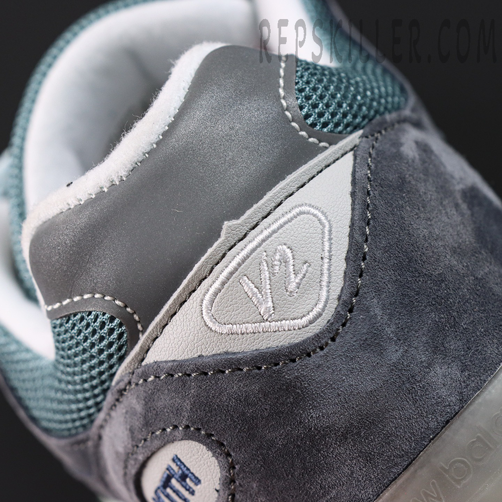 Kith x New Balance 991v2 ‘Osaka Pack’ heel collar detail showing V2 logo on grey panel