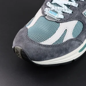 Kith x New Balance 991v2 ‘Osaka Pack’ close-up of left toe box with mesh and leather panels