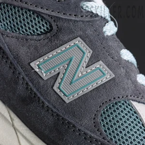Kith x New Balance 991v2 ‘Osaka Pack’ mid-panel showing stitched N logo in grey and teal