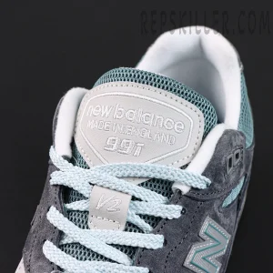 Close-up of Kith x New Balance 991v2 ‘Osaka Pack’ tongue showing ‘Made in England 991’ embroidery