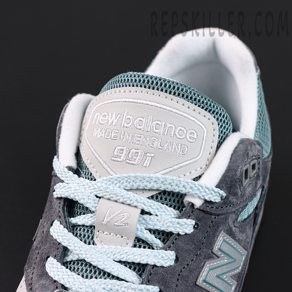 Close-up of Kith x New Balance 991v2 ‘Osaka Pack’ tongue showing ‘Made in England 991’ embroidery