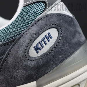 Macro shot of Kith x New Balance 991v2 ‘Osaka Pack’ suede heel area with navy embroidered KITH branding