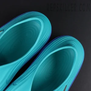 Heel close-up of the Nike ReactX Rejuven8 ‘Dusty Cactus Persian Violet’, featuring the gradient heel tab and functional pull loop.