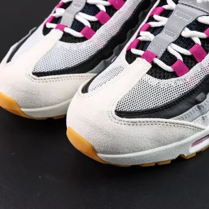 Nike SB x Air Max 95 ‘Cactus Flower’ toe box close-up, white suede mudguard with black mesh underlay and magenta lace loops.