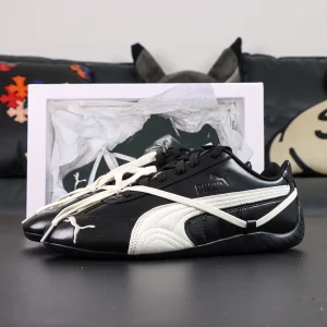 Rosé x Wmns Speedcat Premium ‘Black’ display shot with special box and white tissue paper, emphasizing premium packaging.