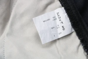 Saint Michael Paint-Splattered Raw Hem Denim Shorts Wash tag