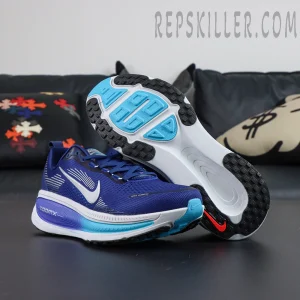 Nike Vomero 18 ‘Blue Void Metallic Silver’ outsole view with aqua rubber pods and black traction