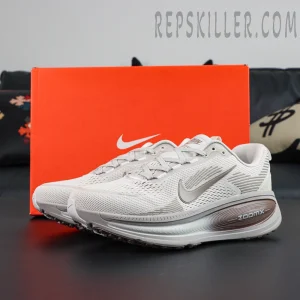 Nike Zoom Vomero 18 ‘Pale Ivory Red Sepia’ full side view with original Nike orange box in the background