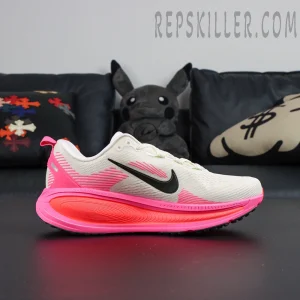 Nike Vomero 18 ‘Sail Hyper Pink’ front angle showing midsole gradient and Swoosh