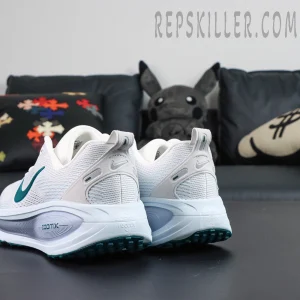 Nike Vomero 18 ‘Summit White Geode Teal’ rear angle showing grey suede heel support and branding details