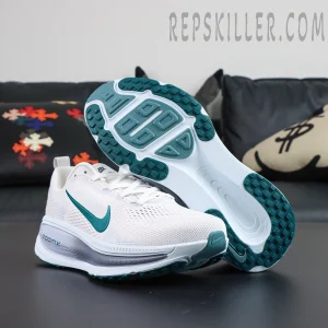 Nike Vomero 18 ‘Summit White Geode Teal’ outsole view featuring teal traction pods and curved stability arch
