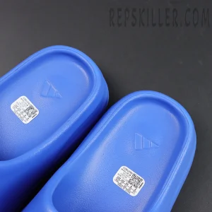 Yeezy Slides ‘Azure’ top view showing embossed adidas logo on footbed