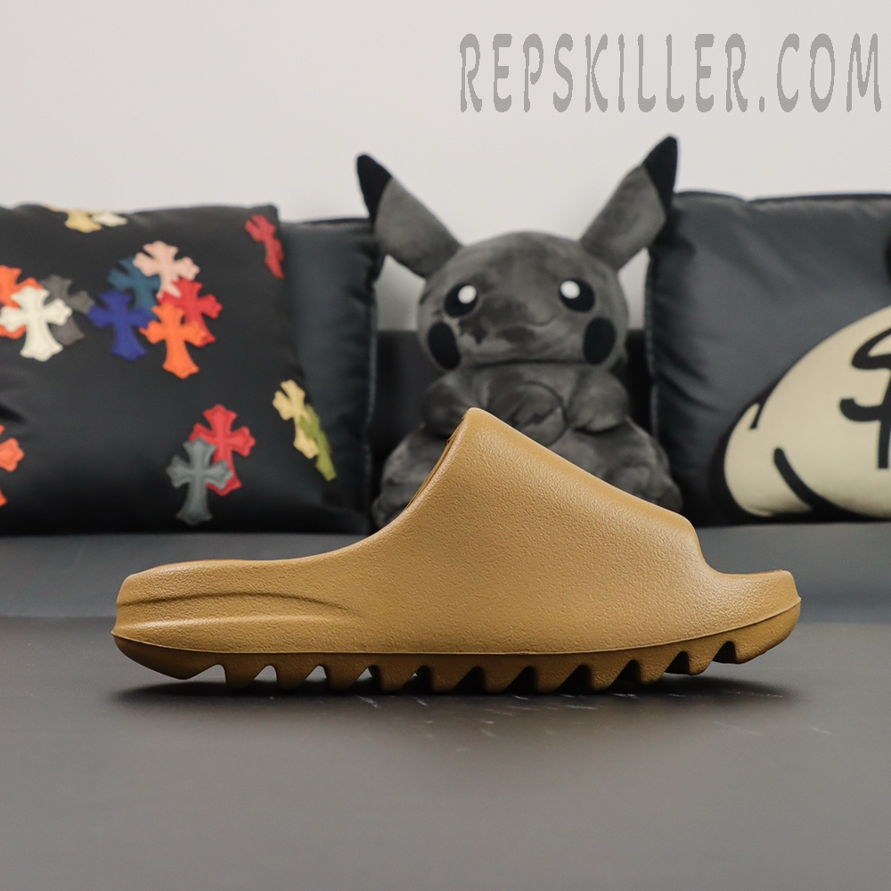 Side profile view of Yeezy Slides ‘Ochre’ highlighting clean silhouette