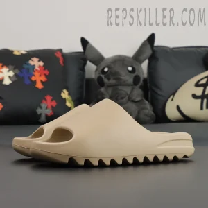 Yeezy Slides ‘Pure’ side profile view showcasing minimalist EVA foam design