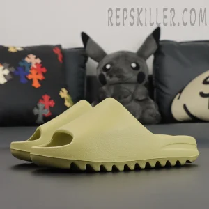 Angled view of Yeezy Slides ‘Resin’ 2022 highlighting smooth matte finish.