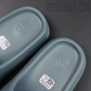 Close-up of the footbed logos inside the Yeezy Slides ‘Slate Marine’.