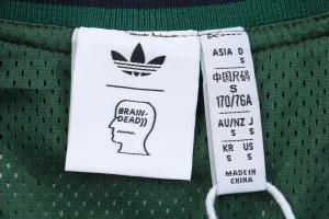 Adidas × Brain Dead V-Neck Sweatshirt Logo tag