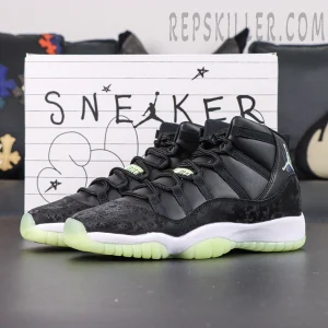 Air Jordan 11 Retro GS ‘Inner Beast’ — Side view showing black upper with luminous green outsole and playful “Sneaker School” backdrop.