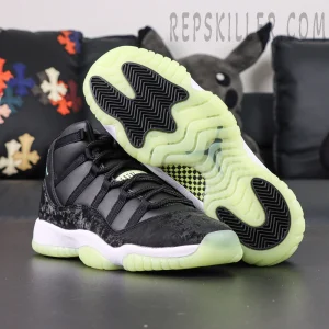 Air Jordan 11 Retro GS ‘Inner Beast’ — Sole detail highlighting translucent glow green outsole with black traction pods.
