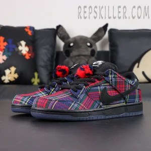 Nardwuar x Nike Dunk Low SB ‘Tam O’ Shanter Hat’ angled pair view showing tartan plaid upper and pom-pom lace decor.
