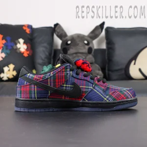 Nardwuar x Nike Dunk Low SB ‘Tam O’ Shanter Hat’ side profile showing black Swoosh and plaid fabric panels.