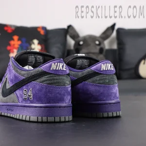 Nike Supreme x Dunk Low SB “Ink” rear angle showing embroidered 94 and layered color blocking of suede panels.