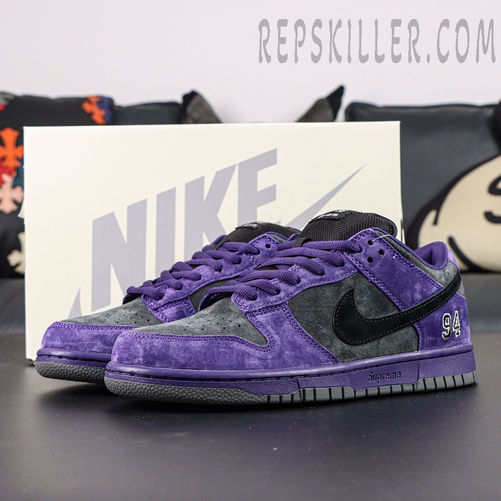 Nike Supreme x Dunk Low SB “Ink” pair front angle showing full silhouette and textural details under soft light.