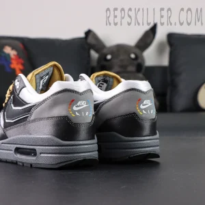 Angled heel view of Nike Air Max 1 “Low Poly - Big Head Mode” emphasizing colorful arc print and layered heel design.