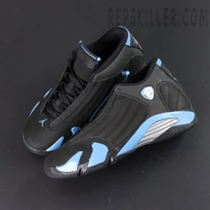 Overhead shot of Air Jordan 14 “Black University Blue” showing asymmetrical design and side emblem.