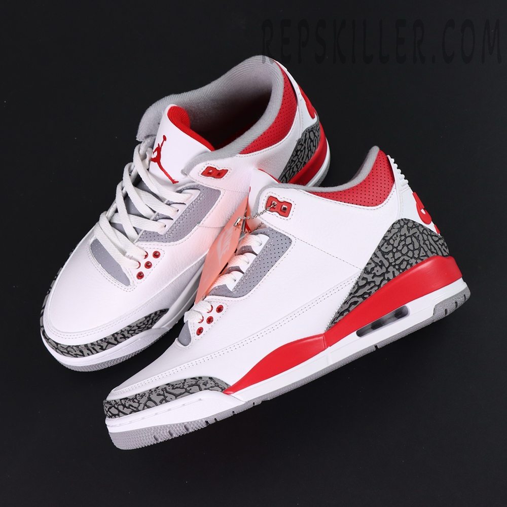 Overhead view of Air Jordan 3 “Fire Red” 2022 pair showing red, white, and grey color details.