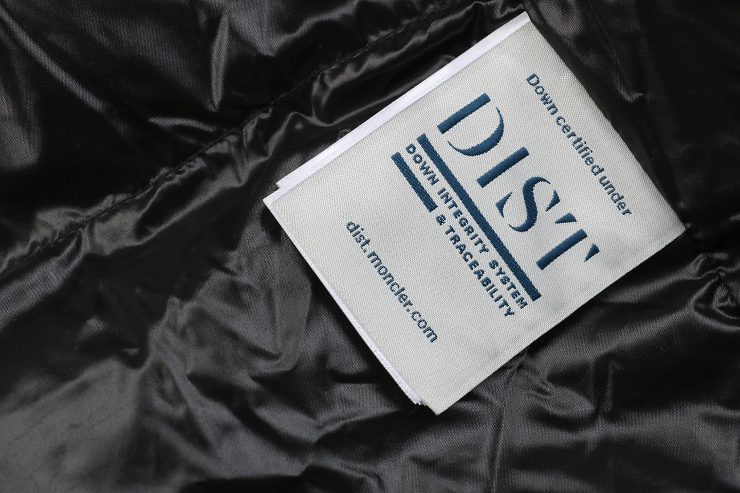 Mxxcler Bosona Logo Long Down Jacket Wash label