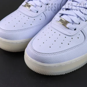 Close-up of NOCTA x Air Force 1 “Palest Purple” toe box highlighting perforations and premium leather texture.